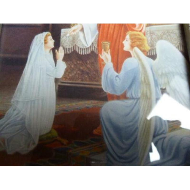 Mooie fotolijst met religieuze afbeelding.