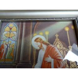 Mooie fotolijst met religieuze afbeelding.