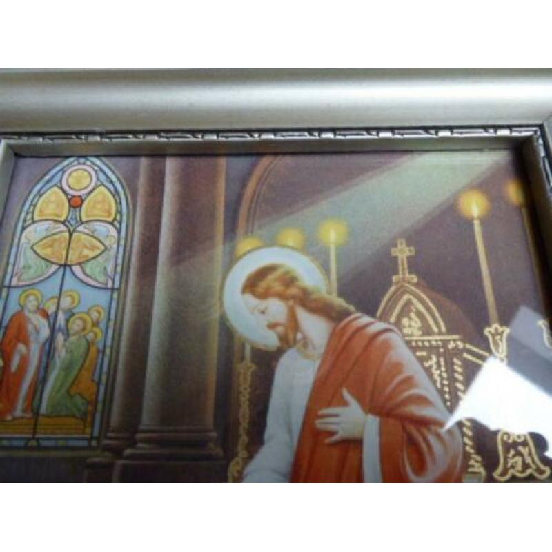Mooie fotolijst met religieuze afbeelding.
