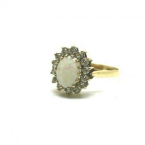 t.k. 9 kt gouden damesring met opaal en cubic zirconia