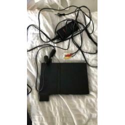 PlayStation 2 met 15 spellen. 2 controles + 4 buzz controles