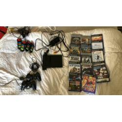PlayStation 2 met 15 spellen. 2 controles + 4 buzz controles