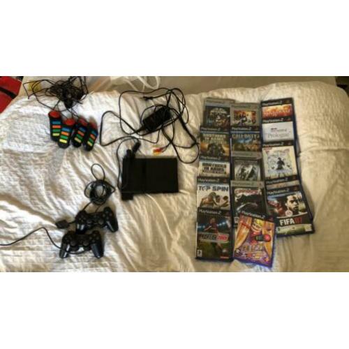 PlayStation 2 met 15 spellen. 2 controles + 4 buzz controles