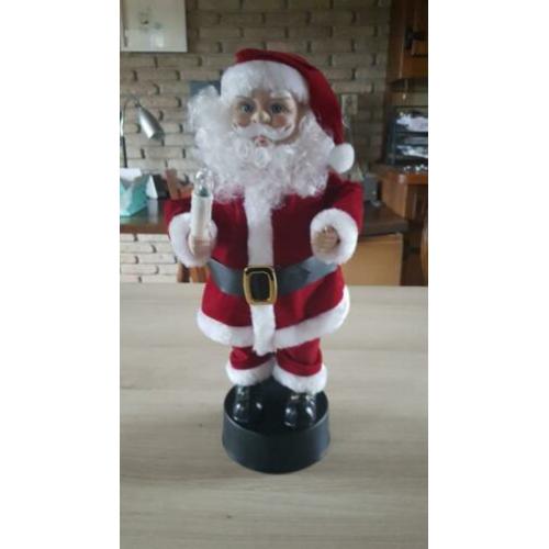 Kerstman, beweegt en speelt muziek
