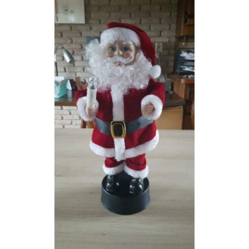 Kerstman, beweegt en speelt muziek