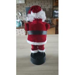 Kerstman, beweegt en speelt muziek