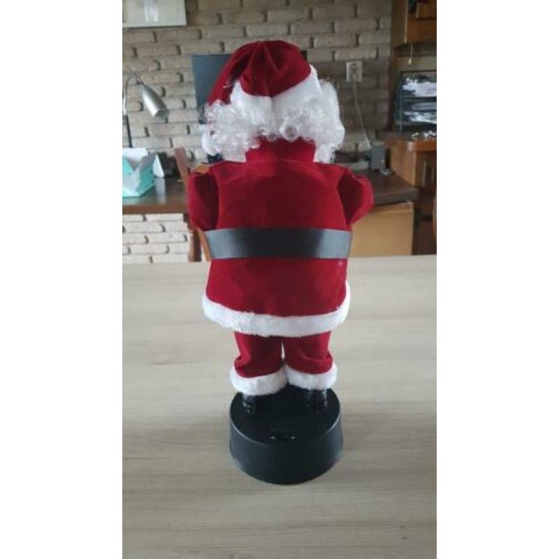 Kerstman, beweegt en speelt muziek